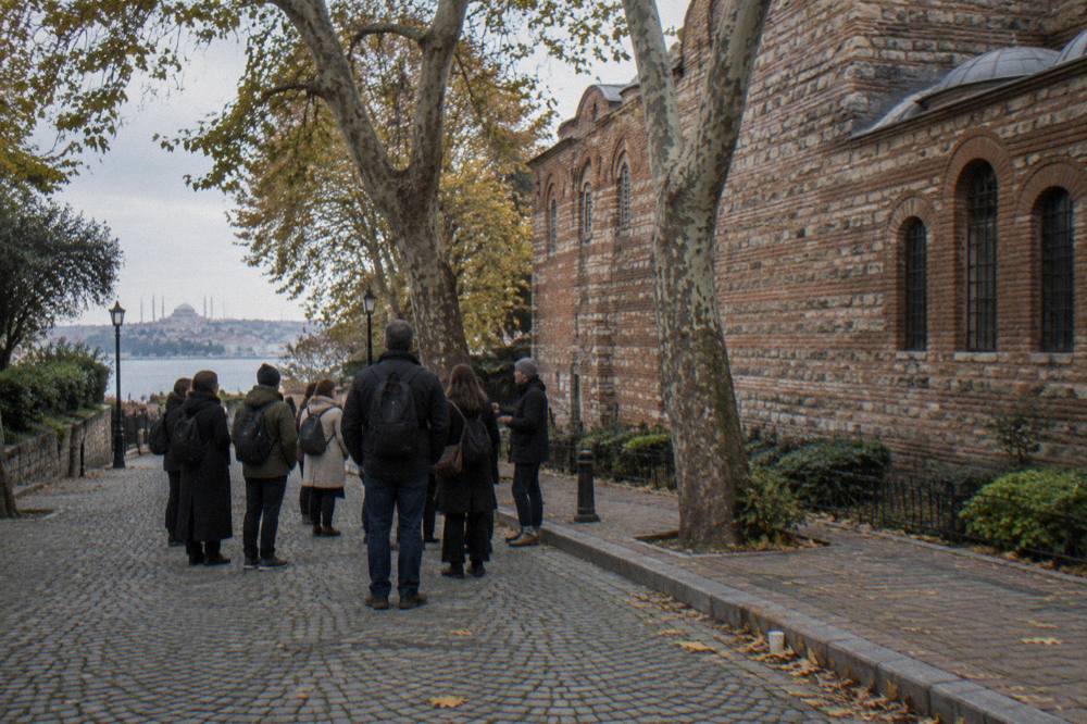 Guided walking group gathered on a cobbled square near Istanbul's historic peninsula