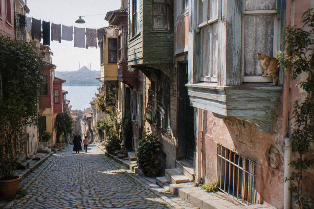 Sunlit alley of colourful restored houses in the Fener and Balat district