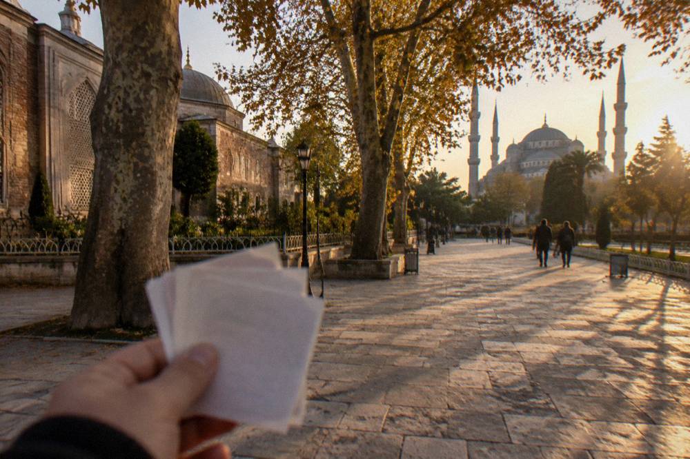 Turkish lira banknotes held out for a tip at the end of a city walking tour
