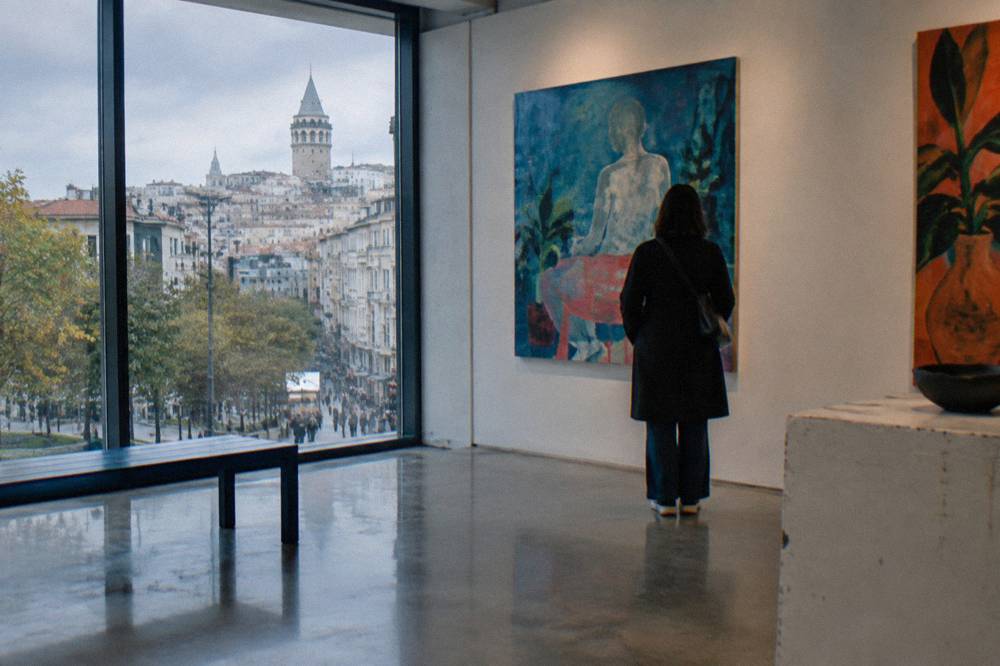 Contemporary art gallery interior in Istanbul with paintings on white walls