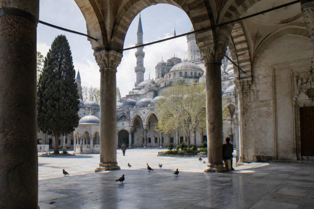 Stone arches and a domed courtyard in Istanbul's historic Sultanahmet district