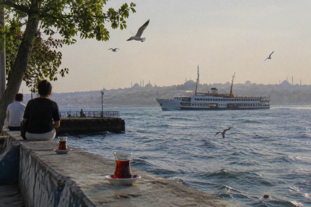 A public ferry crossing the Bosphorus with the city skyline behind it