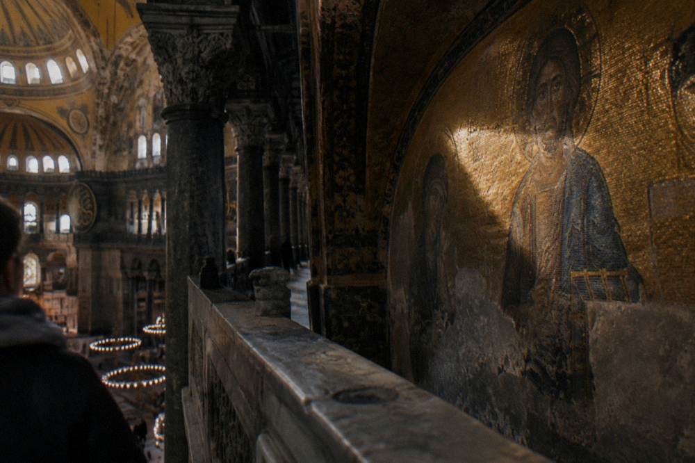 Byzantine mosaic detail visible along the upper gallery walkway of Hagia Sophia